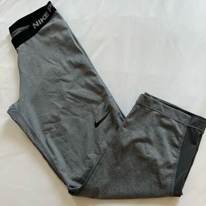 Nike mid calf leggings color gray. Size Medium, only worn once